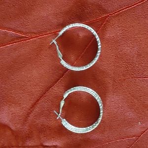 Silver hooped earrings.